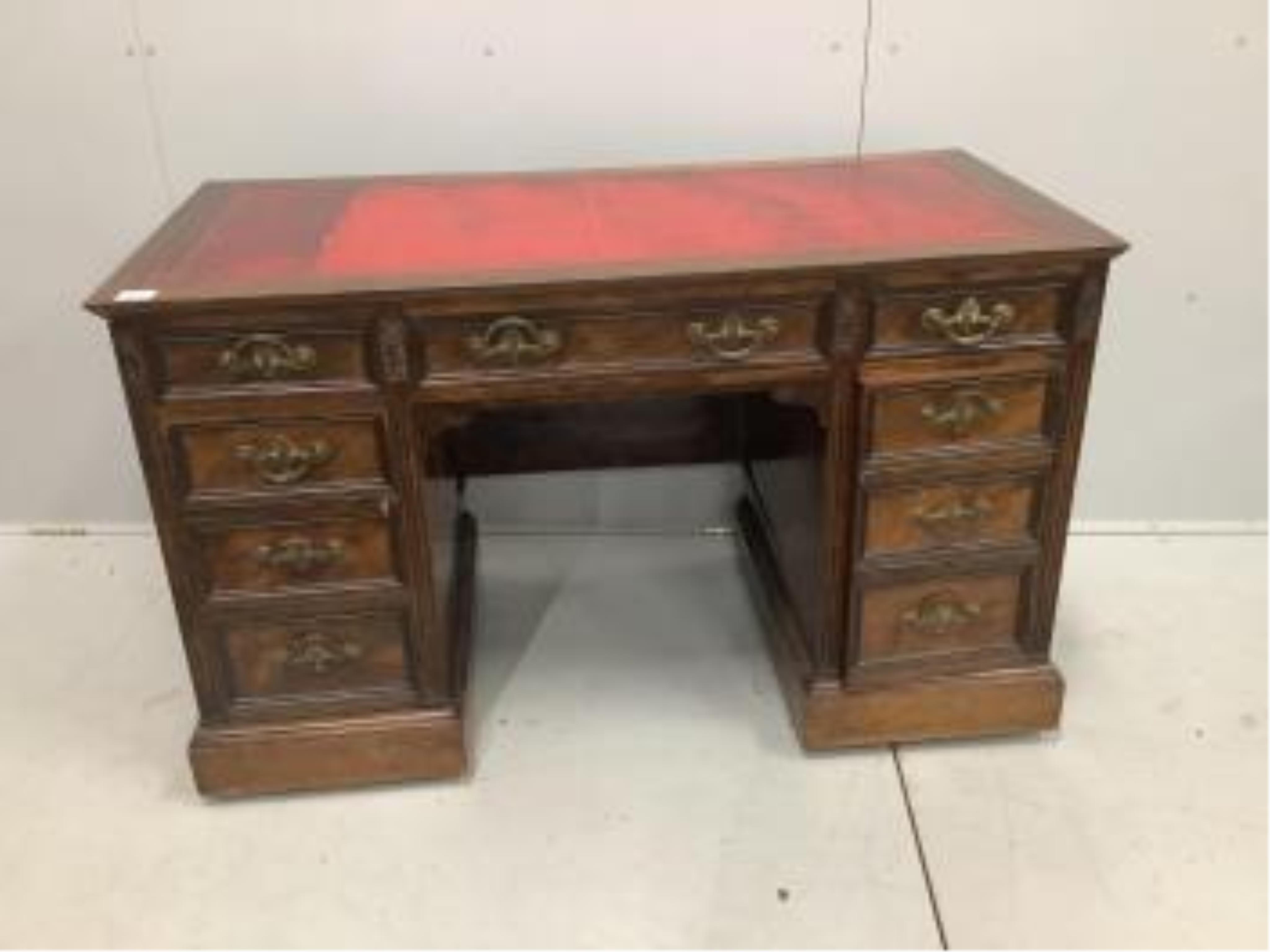 An Edwardian mahogany pedestal desk, pedestals with dummy front drawers, width 121cm, depth 59cm, height 73cm. Condition - fair to good